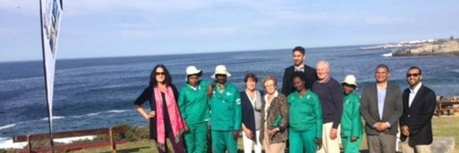 Mayor Botha-Guthrie (centre) flanked by key role players and workers of the Hermanus Biodiversity Walk project